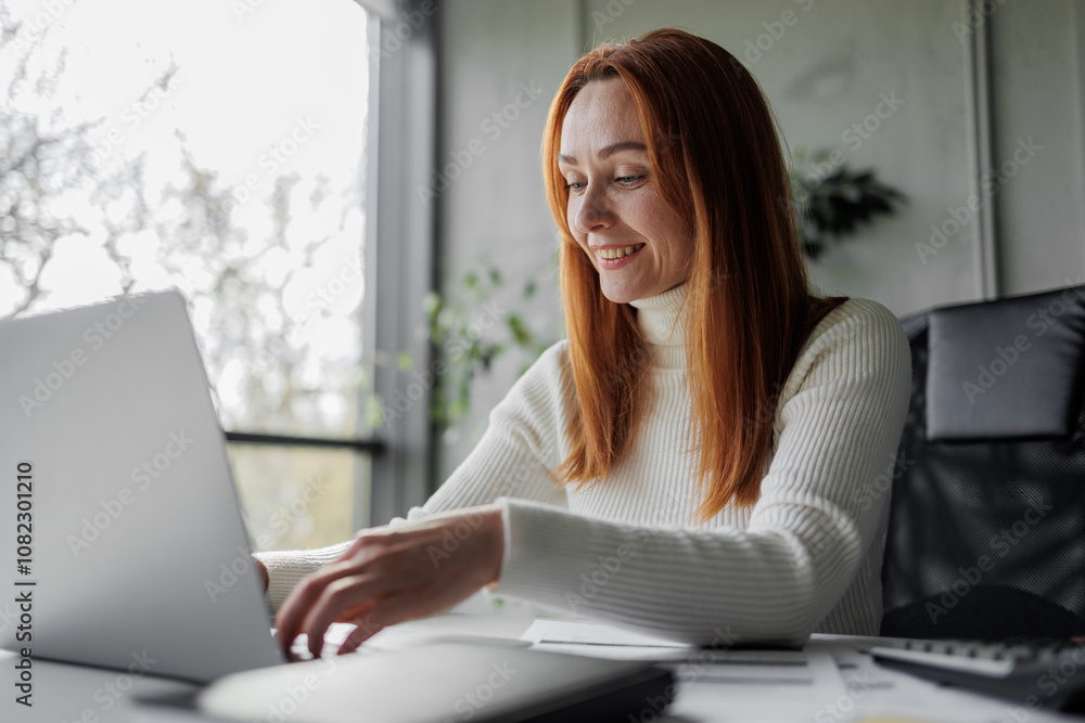Woman Working on Laptop in Modern Office Woman Working on Laptop in Modern Office