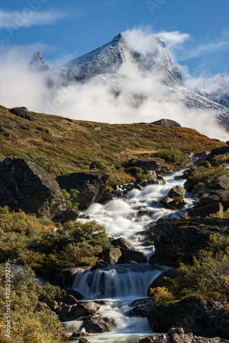 View of Ulamertorsuaq mountain and the view of surrounding mountains and glaciers in Tasermiut fjord (South Greenland)