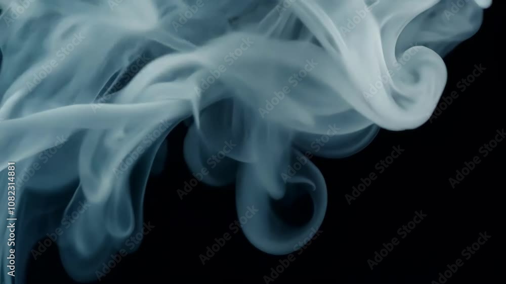 Ethereal White Vapour in Slow Motion on a Black Background Ethereal White Vapour in Slow Motion on a Black Background