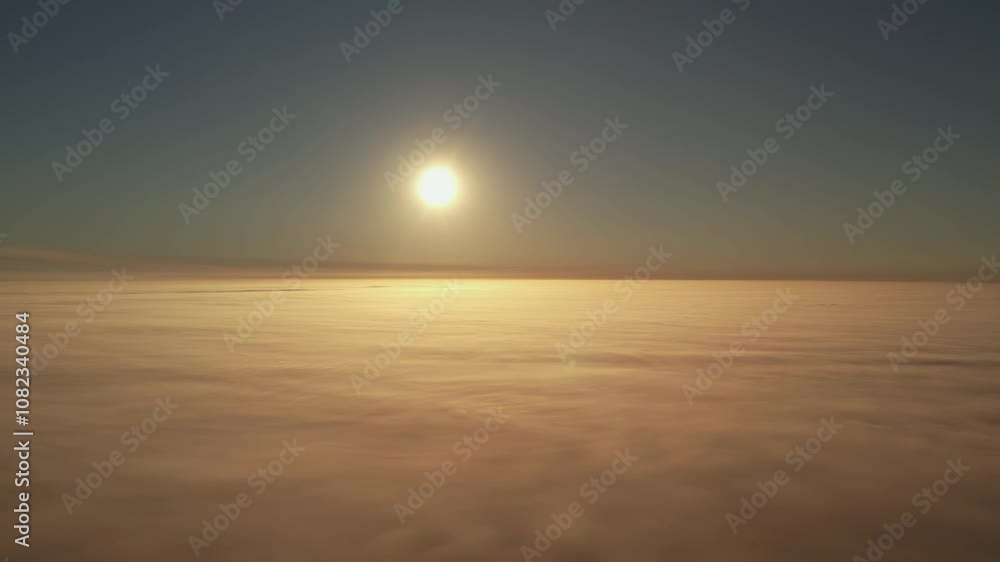 Bright Sun Above Soft Clouds at Sunset Horizon.
Serene scene of the sun setting above a layer of soft clouds, creating a warm and tranquil atmosphere with gentle hues. Bright Sun Above Soft Clouds at Sunset Horizon.
Serene scene of the sun setting above a layer of soft clouds, creating a warm and tranquil atmosphere with gentle hues.