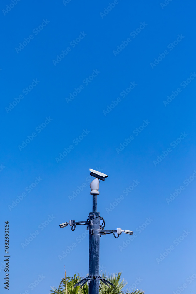 Valletta, Malta A security camera on the street against a blue sky. Valletta, Malta A security camera on the street against a blue sky.