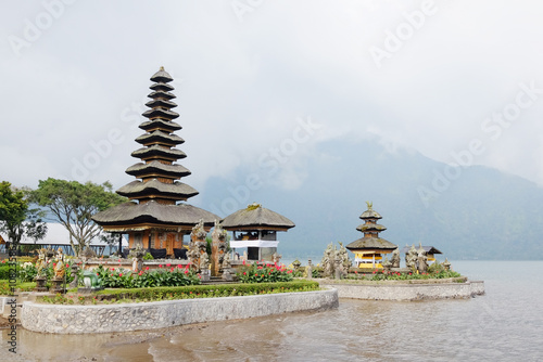 Pura Ulun Danu Bratan temple is landmark of Bali for use in Buddhist and Hindu religious ceremony located in lake and mountain on Bali island of Indonesia. Travel destination for culture of Asian photo