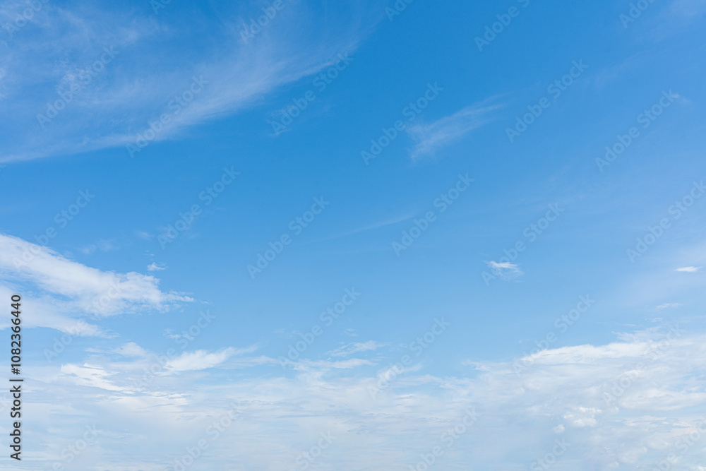 Beautiful blue sky with fluffy white clouds drift across the vast expanse of heaven Beautiful blue sky with fluffy white clouds drift across the vast expanse of heaven
