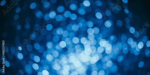 Abstract blue bokeh background with a festive feel.