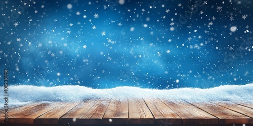 Festive winter scene with snow-covered wooden table and falling snowflakes against a blue background, perfect for seasonal and holiday themes.