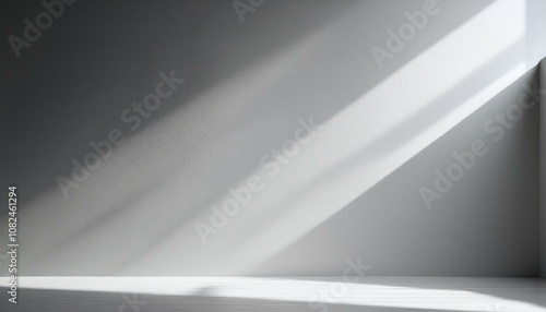 minimalistic abstract light grey wall background for product presentation with sunlight shadow