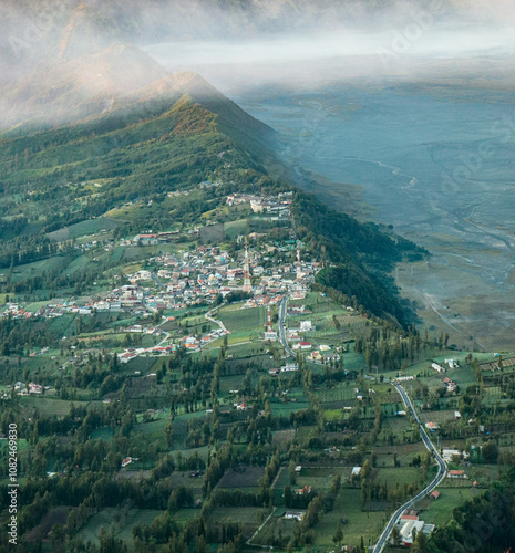 Misty Morning View of Cemoro Lawang, Indonesia photo