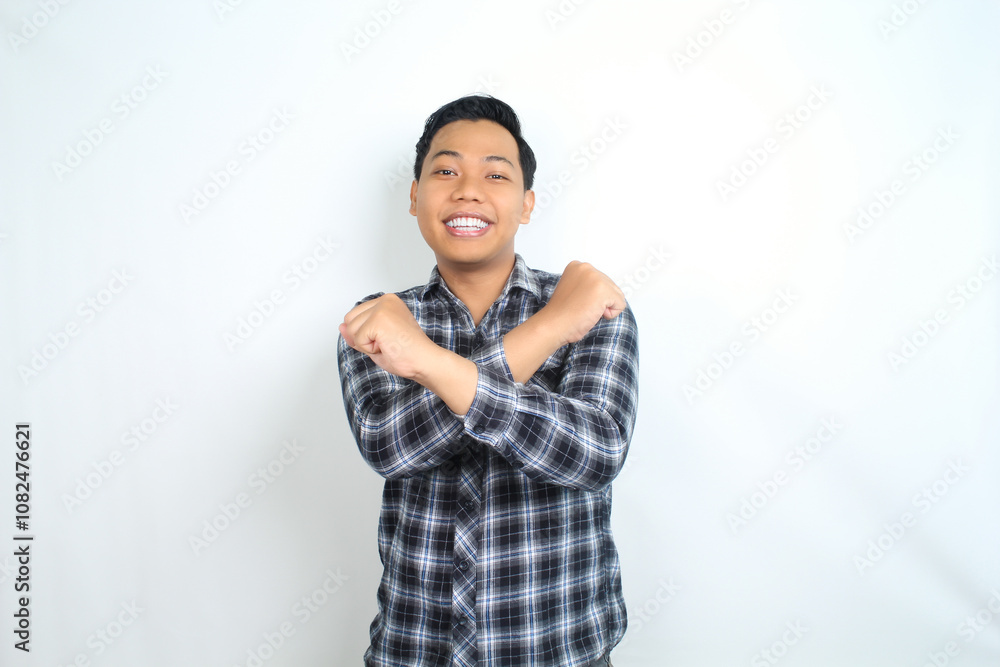 asian man show stop signs with smiling face isolated on white background asian man show stop signs with smiling face isolated on white background