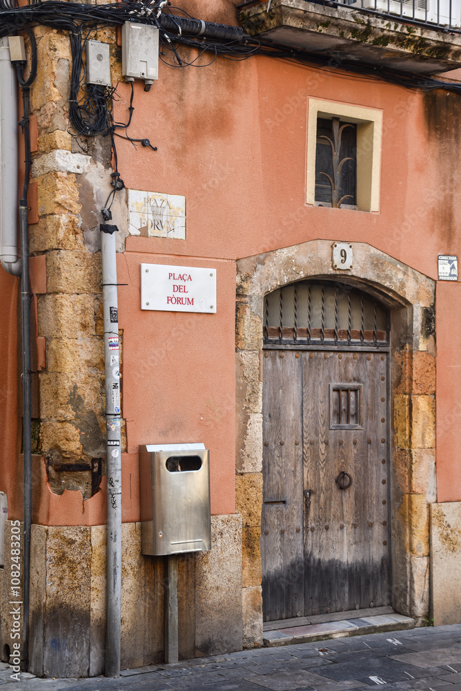 facade of a corner house in the old streets of Tarragona, spain
