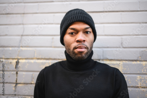 Fashion portrait of black man in city in modern spring or fall season outfit.