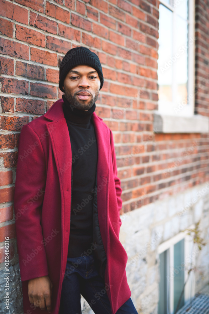 Obraz premium Fashion portrait of black man in city in modern spring or fall season outfit.
