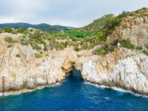 Scenic Coastal Cliffside With Vibrant Greenery and Pristine Blue Waters