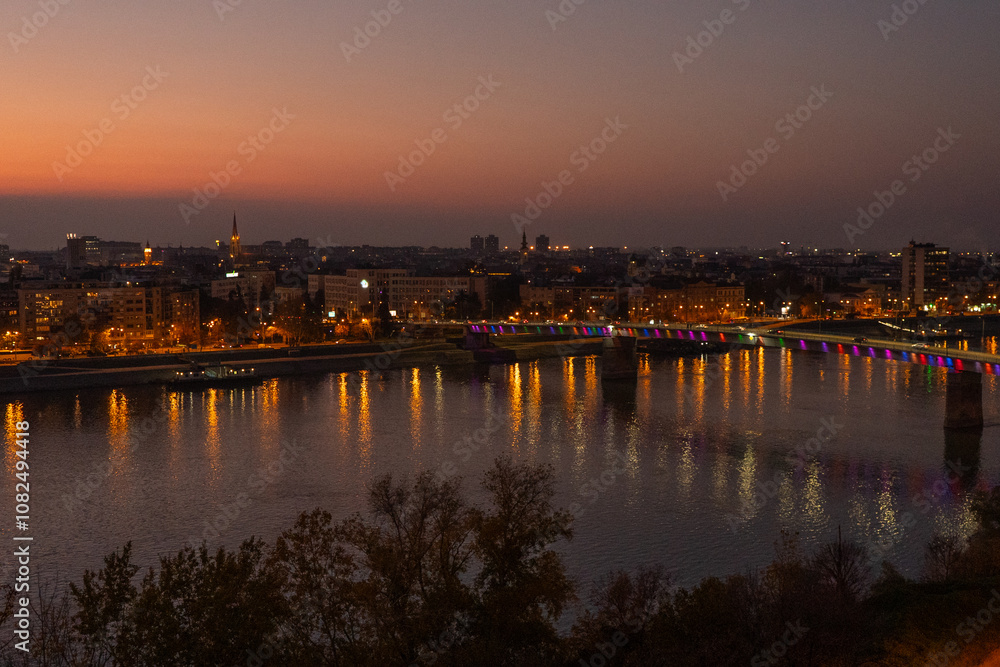 Fototapeta premium Panorama of Novisad on the Danube after the red sunset