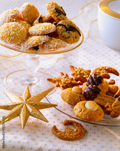 Festively Decorated Cookies On A Table For Holiday Celebration. A assortment of baked christmas sweets. The treats include coconut macaroons, chocolate-dipped cookies, and nut-topped delights