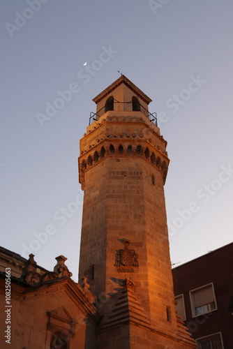Lighthouse tower in the dusk and moon