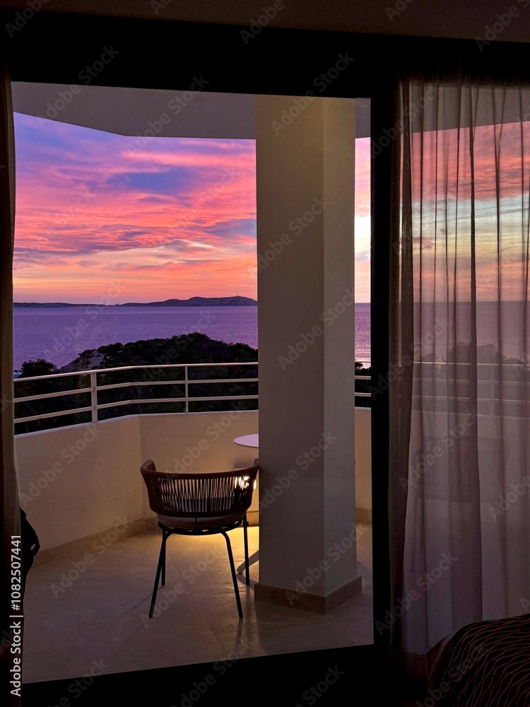 Fototapeta premium Romantic Balcony Sunset View from a Cozy Room