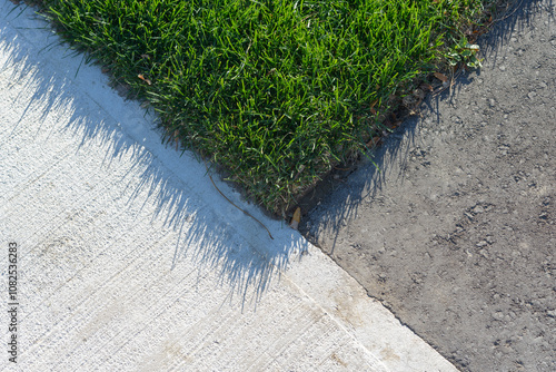 where sod, pavement, and asphalt covers meet