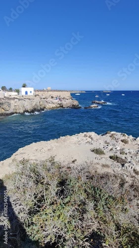 Waves crashing on rocky coastline of tabarca island photo