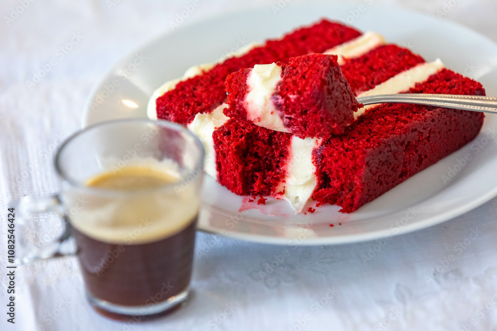 Traditional and delicious red velvet cake isolated on white plate Traditional and delicious red velvet cake isolated on white plate