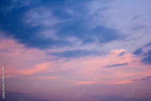 a purple and pink sky with a purple and purple sunset