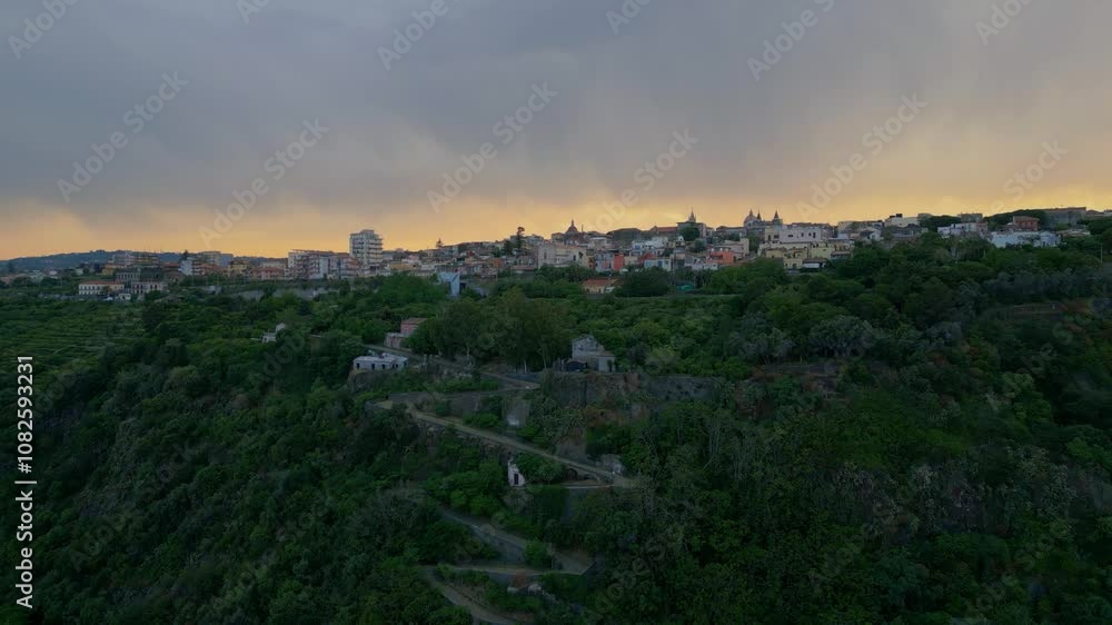 Aerial approaching view of the town of Acireale, on the East coast of Sicily at sunset Aerial approaching view of the town of Acireale, on the East coast of Sicily at sunset
