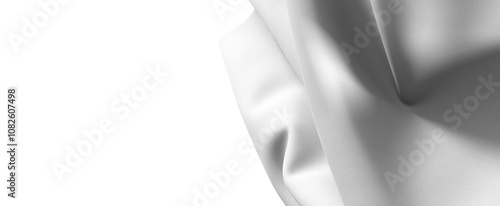 A close-up of a smooth gray fabric texture. The fabric is draped and flowing, creating abstract patterns and waves.