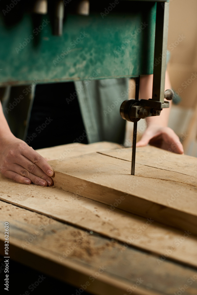 A determined female carpenter carefully works on shaping wood in a well-lit workshop, showcasing her skills. A determined female carpenter carefully works on shaping wood in a well-lit workshop, showcasing her skills.