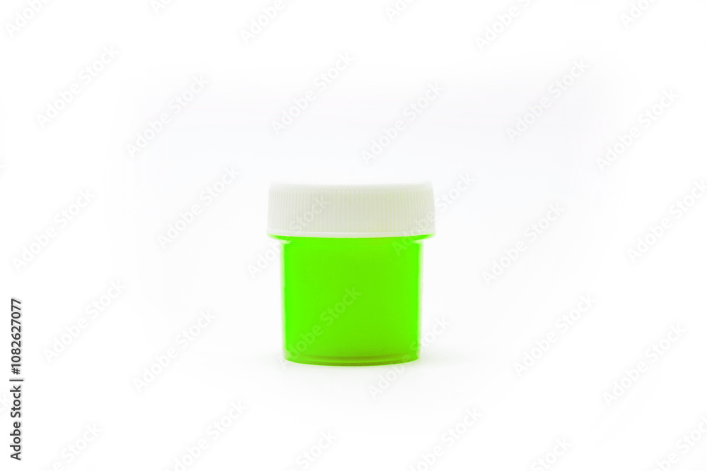 a small jar of green gouache a small jar of green gouache