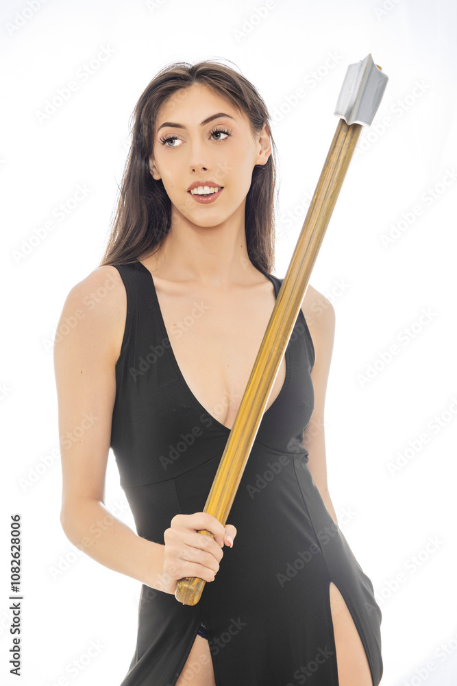 Woman in Black Dress Holding Axe in Bright Studio with Plastic Backdrop Woman in Black Dress Holding Axe in Bright Studio with Plastic Backdrop