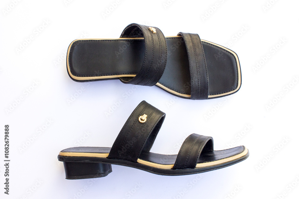 A pair of beautiful women's strap open-toed slippers. These slippers are made of synthetic leather. A pair of beautiful women's strap open-toed slippers. These slippers are made of synthetic leather.