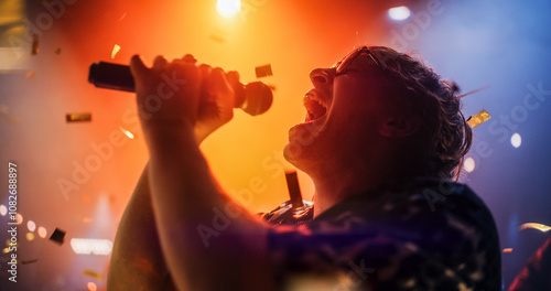 Energetic Rock Band Performing on a Nightclub Stage with Dynamic Lights and Special Effects. Portrait of an Artist Creating a Unique Show Experience With Powerful Alternative Songs photo