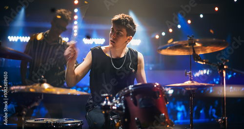 Portrait of a Stylish Lead Singer Performing at a Rock Concert Live on Stage. Talented Musician Bringing His Unique Attitude, Playing Energetic Rock Hits. Young Band Playing For the Crowd photo