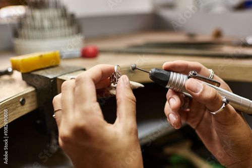Canvastavla An artisan expertly shapes beautiful jewels while surrounded by a lively workshop atmosphere