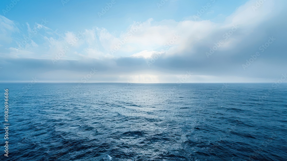 custom made wallpaper toronto digitalA vast expanse of blue ocean stretches to the horizon under a sky filled with fluffy white clouds.