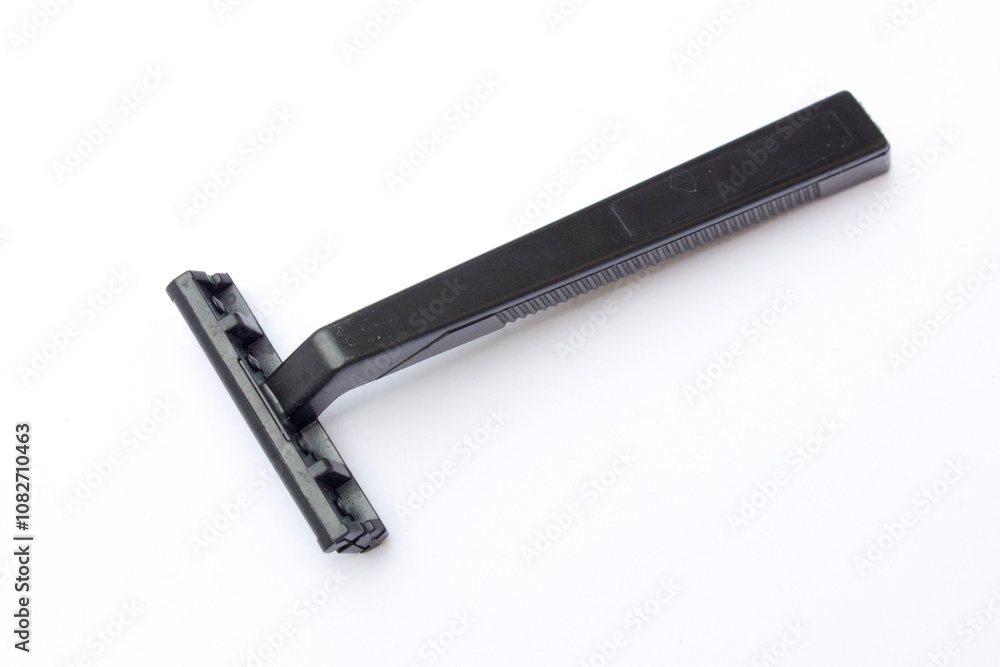 Disposable plastic black body manual shaver isolated on white background. Disposable plastic black body manual shaver isolated on white background.