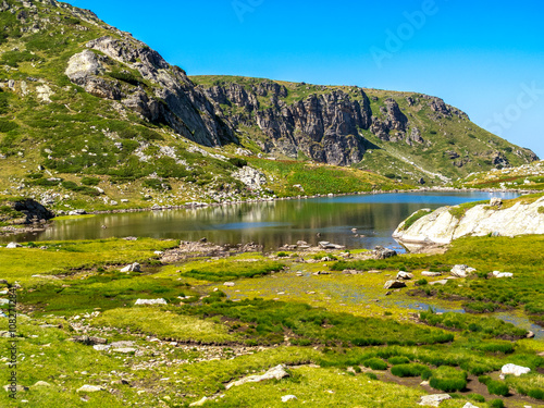 Bulgarian Rila Mountains beautiful landscape with view towards Trilistnika Lake or the Trefoil Lake at the Seven Rila Lakes photo