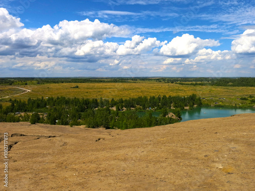 picturesque summer lake surrounded by birches and rocks with blue water in Konduki, Russia photo