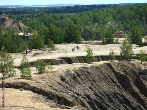 rocks with rare trees and crystal blue water in the Konduki quarry, Tula region, Russia