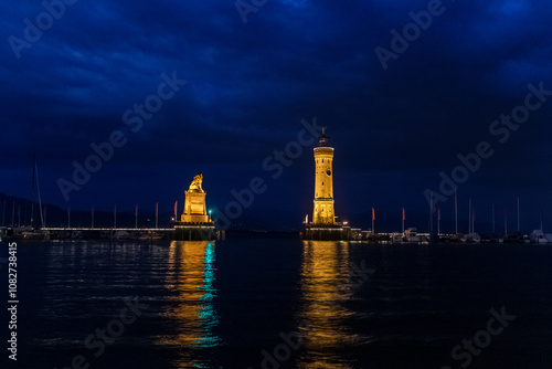 the famous lighthouse at the island of Lindau at the Bodensee by night, Germany photo