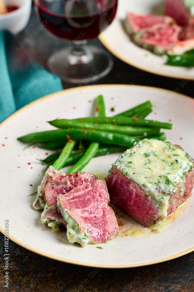 Sliced rare steak with blue cheese sauce Sliced rare steak with blue cheese sauce