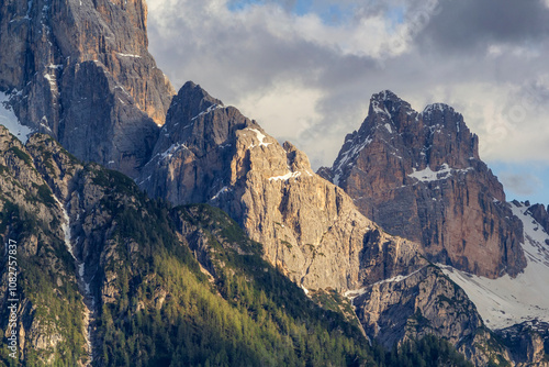 a breathtaking close view to the mountains of Rocca dei Baranci called Haunold in sunset near the valley of Dobbiaco in South Tyrol, Italy photo