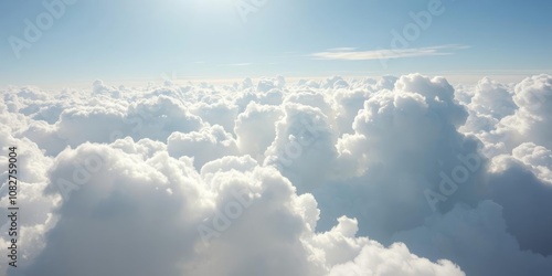 Fluffy white clouds in a blue sky creating a soft and peaceful texture, heavenly, atmospheric, bright