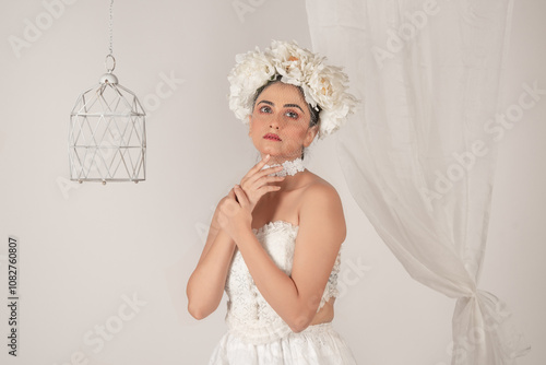 Obraz na płótnie Portrait of a beautiful fashion model dressed in white as a bride. w salonie