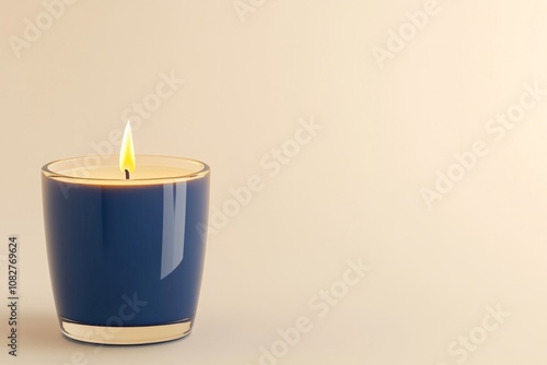 Luxurious navy blue candle with golden flame casting soft shadows in a warm elegant atmosphere