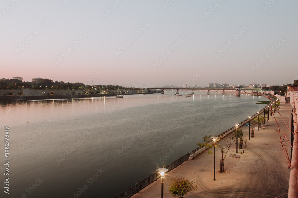 Fototapeta premium Ahmedabad Waterfront - Photos of River Sabarmati at dawn and sunrise. Images of the the city of Ahmedabad which is the largest city in the state of Gujarati in India.