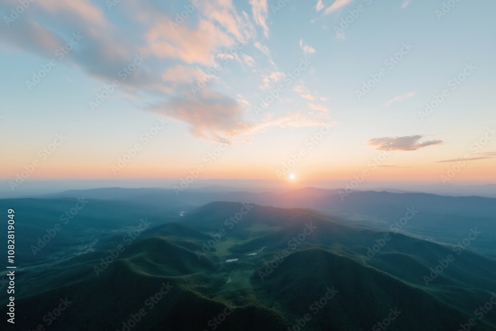 The sky is a beautiful shade of blue with a few clouds scattered throughout. The sun is setting, casting a warm glow over the mountains in the distance. The scene is serene and peaceful The sky is a beautiful shade of blue with a few clouds scattered throughout. The sun is setting, casting a warm glow over the mountains in the distance. The scene is serene and peaceful