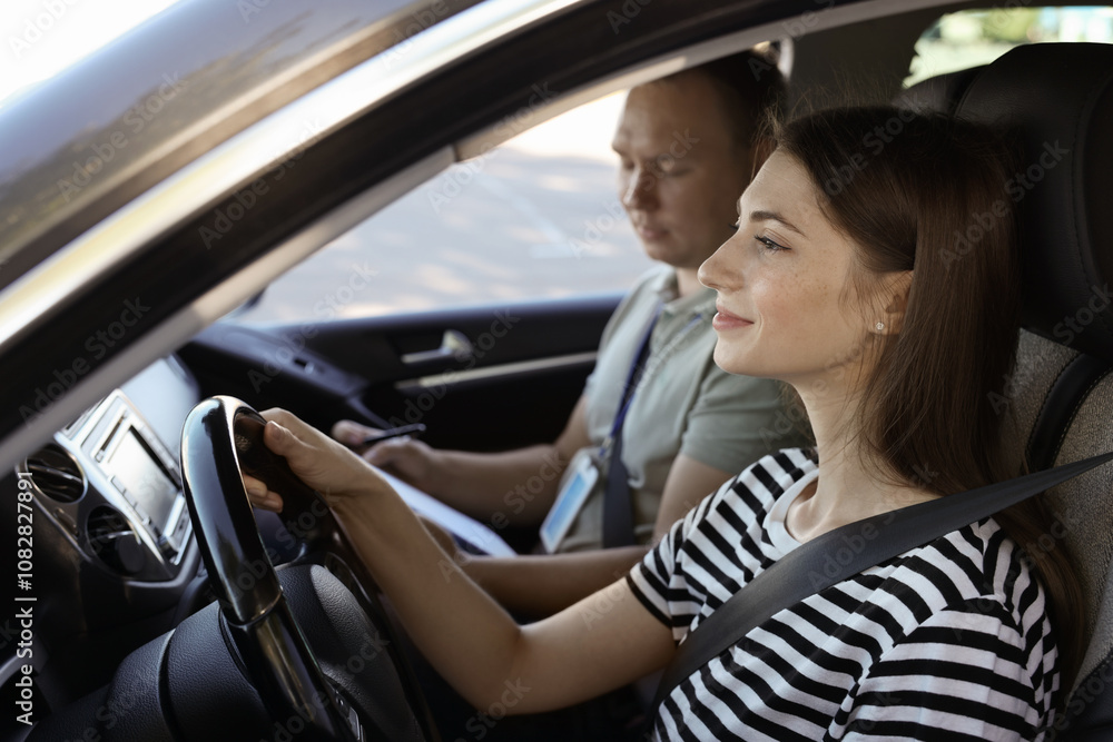 Driving school. Student passing driving test with examiner in car Driving school. Student passing driving test with examiner in car
