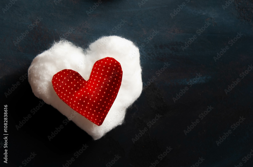 A cloudy white and red heart with dots on a dark background, symbolizing love and celebration. A cloudy white and red heart with dots on a dark background, symbolizing love and celebration.