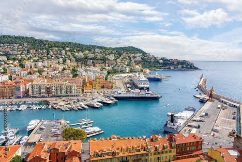 Nice, France. View of the old port of Nice, cruise liners, yachts and lighthouse, city on the hill. French Riviera.
