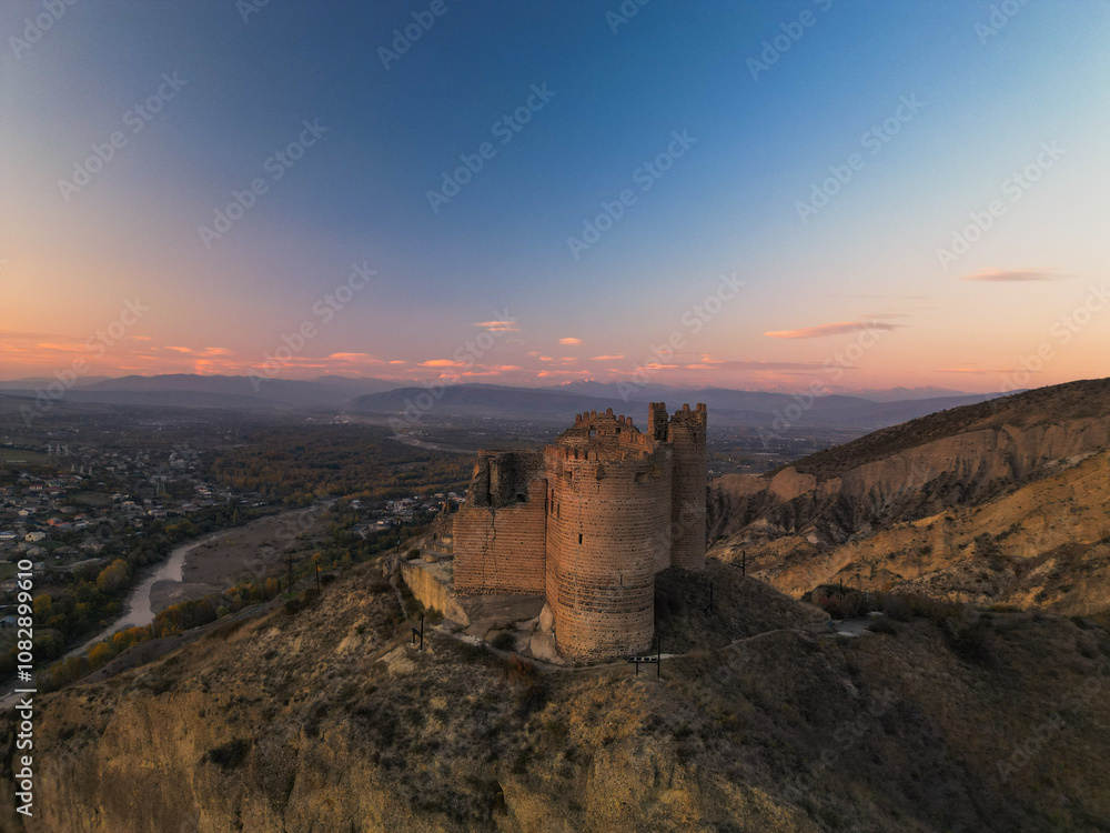 Fantasy fortress at sunset in the mountains of Georgia - Aerial Drone View, Fantasy fortress at sunset in the mountains of Georgia - Aerial Drone View,